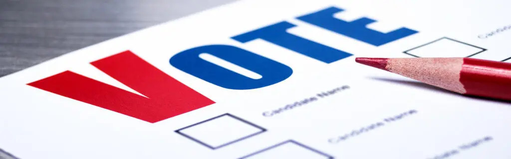 A close up of the word vote on paper