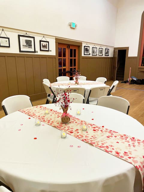 A round table decorated for Valentine's Day