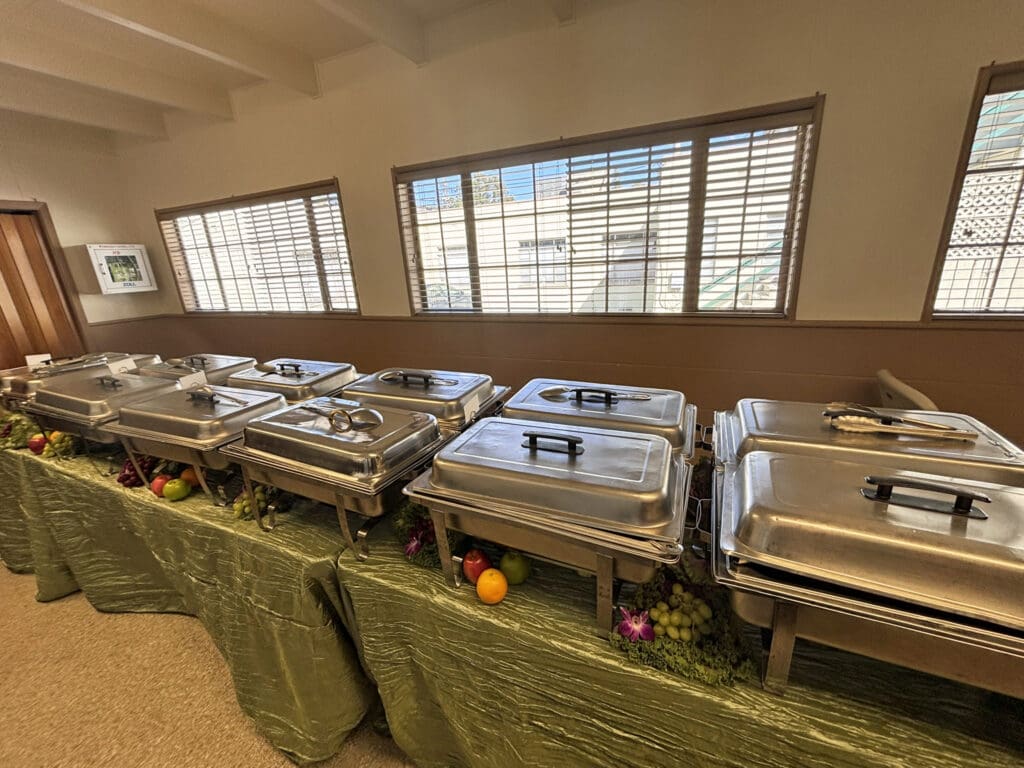 Tables lined with stainless steel food warmers